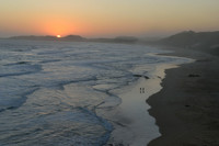Couple walking on the beach sunset time