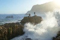 Men fishing standing on the rock