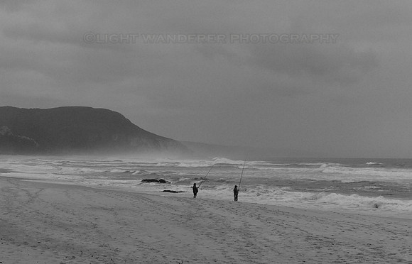 Men fishing on the beach