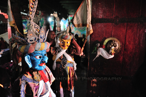 Monks wearing masks and costumes