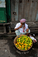 Street hawker with lime fruits