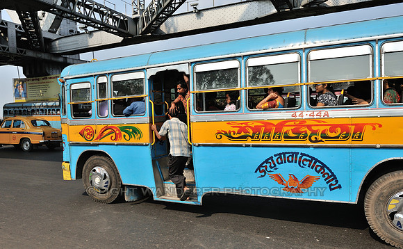 Man hopping into a bus