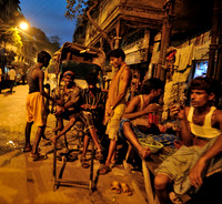 Rickshaw pullers on a brake