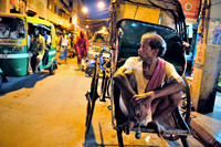 Rickshaw puller with alarm bell