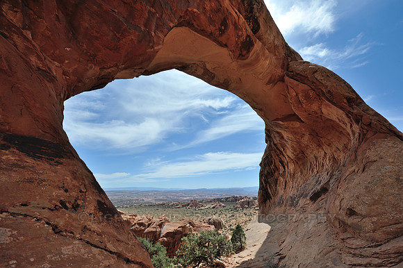 Desert and sky seen through an arch
