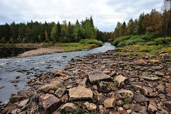 Smaller river joins Muonionjoki-river in Lapland