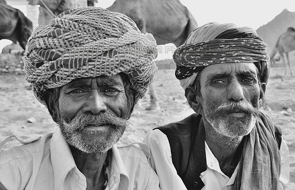 Two camel herders with turbans and large mouctache