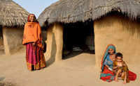 Thatched huts of Bishnoi, ladies in colourful clothes