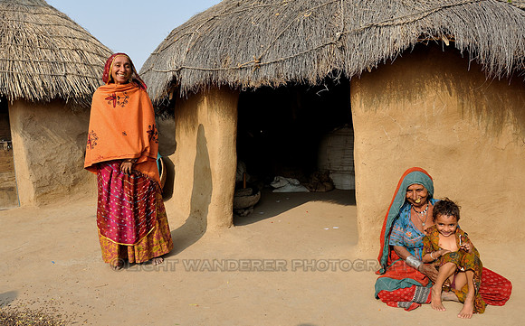 Thatched huts of Bishnoi, ladies in colourful clothes