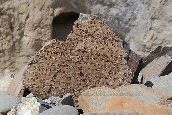 Tibetan buddhist holy texts carved on the stone