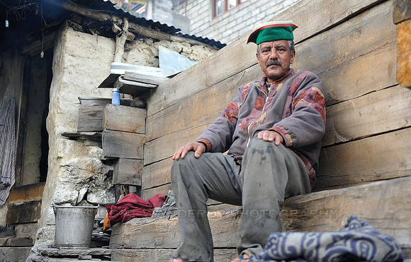 Kinnauri man in front of his house