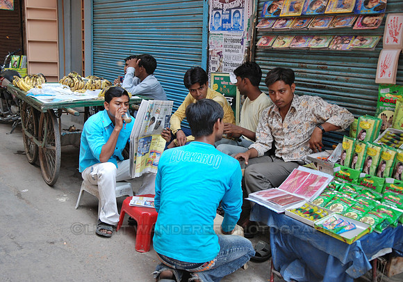 Young men drinking chai, sitting and talking