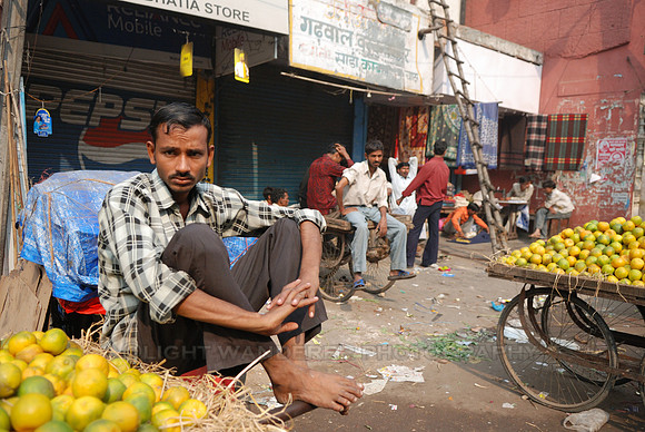 Orange seller with serious expression