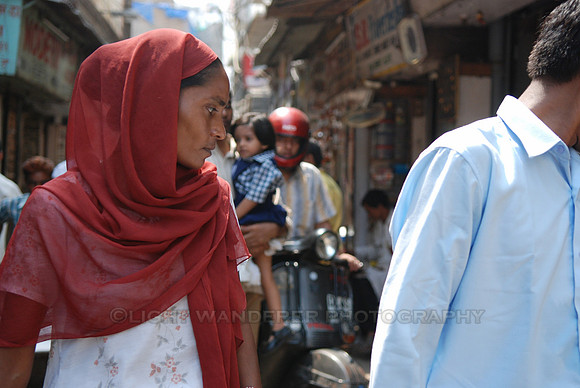 Woman with red head scarf in