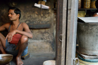 Man sitting on the floor of shop