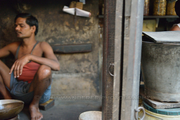 Man sitting on the floor of shop