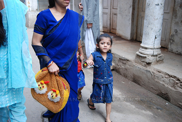 Small girl walking with mother