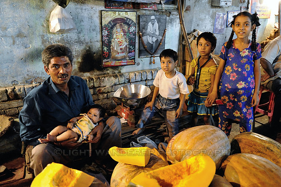 Pumpkin seller with his kids