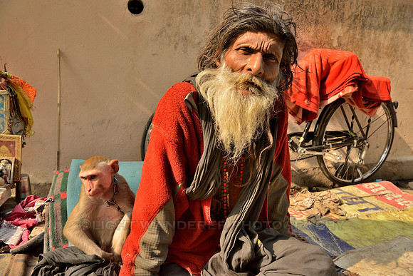Sadhu with pet macaque