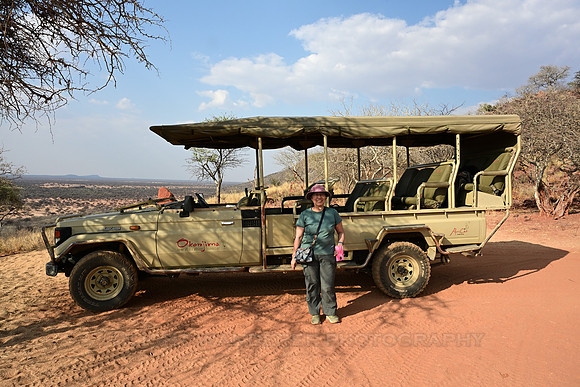 Posing in front of safari car